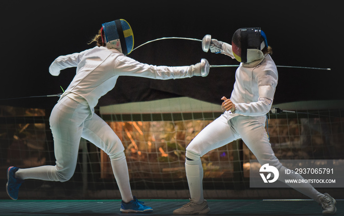 Two man fencing athlete fight on professional sports arena