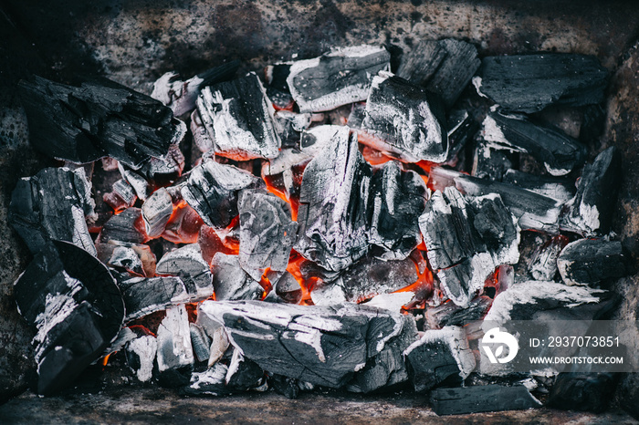 top view of hot burning coals with ash in fireplace