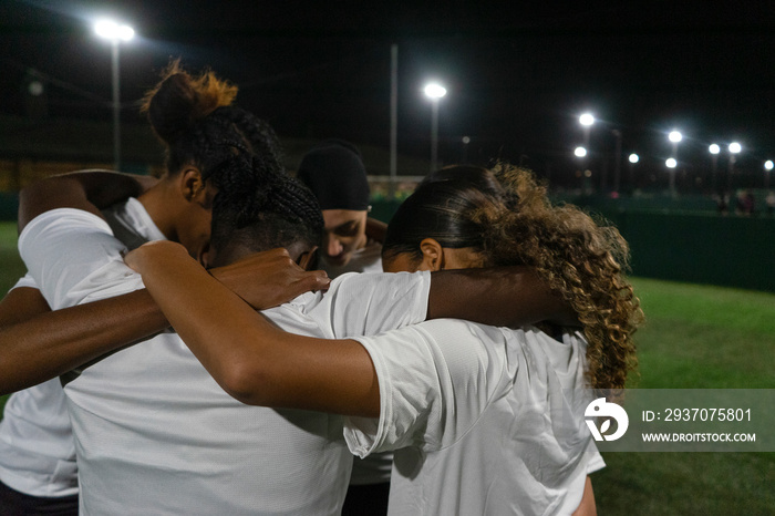 Female soccer players teaming up