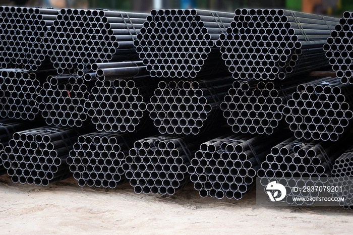 Black steel pipe bundles at the construction site