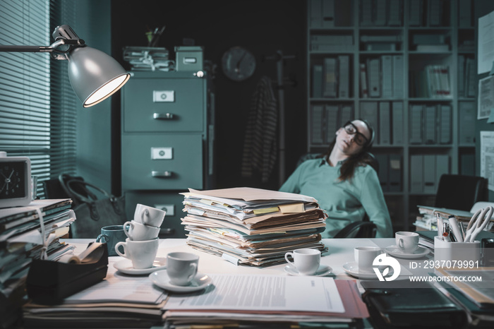 Exhausted office worker falling asleep in the office