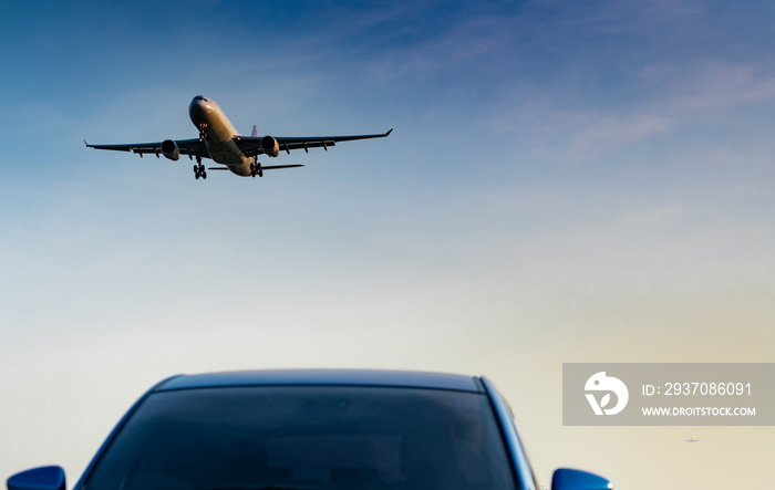 Commercial airline. Passenger plane landing approach blue SUV car at airport with blue sky and cloud