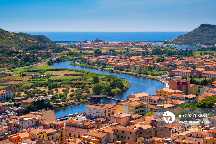 Sardinia, Italy - Panoramic view of the town of Bosa by the Temo river with Bosa Marina resort at th