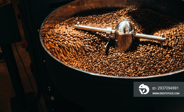 Roasted coffee in roasting machines,Motion blur for background,Banner cover concept background.