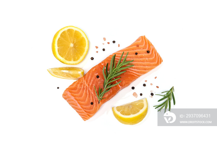 Fresh salmon steak with herbs and lemon isolated on white background
