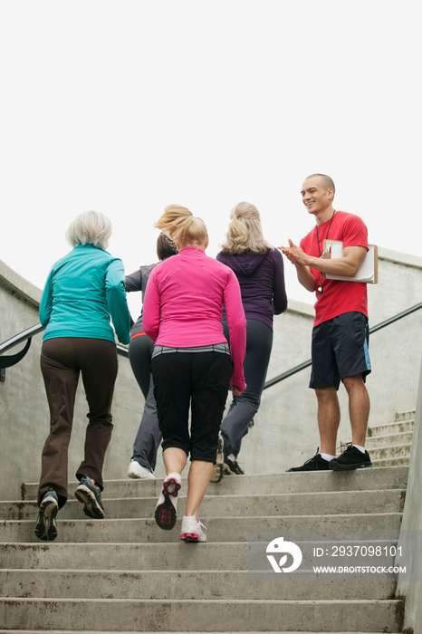 mature women jogging up stairs