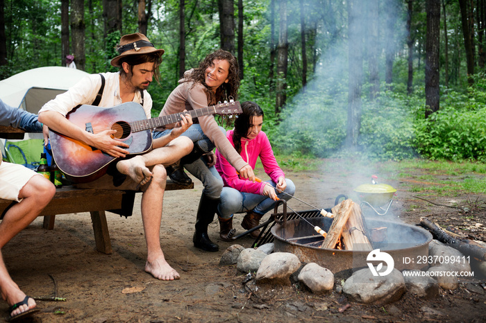 Friends relaxing at campsite