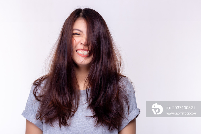 Expression concept. Charming beautiful young woman laughing and gets messy hair. Attractive beautifu