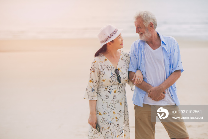 Couple asian wife lovely elder happy care together holiday relax at the beach