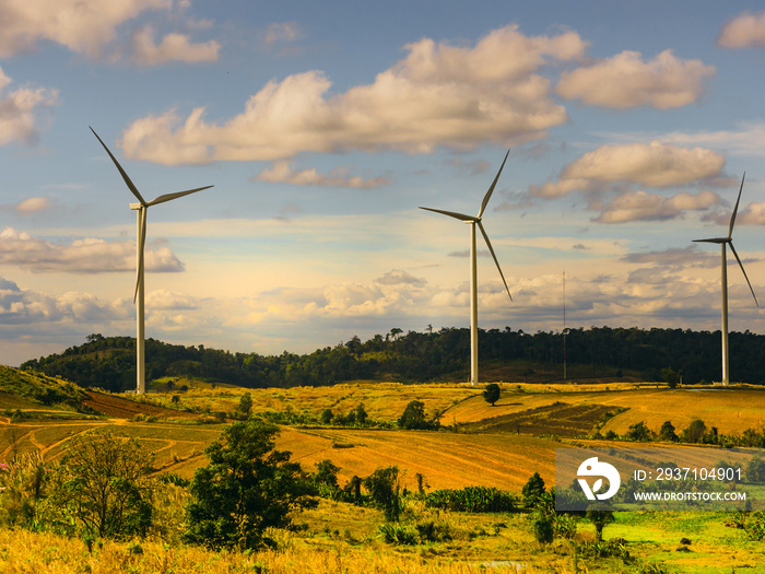 energy saving concept with wind turbine construction in field and meadow with beauty blue sky and cl