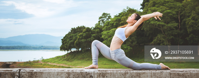 Asian woman doing yoga fitness exercise