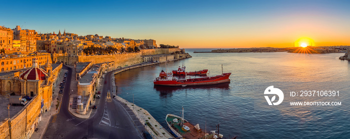 Valletta, Malta - Panoramic skyline view of Valletta and the Grand Harbor with beautiful sunrise, sh