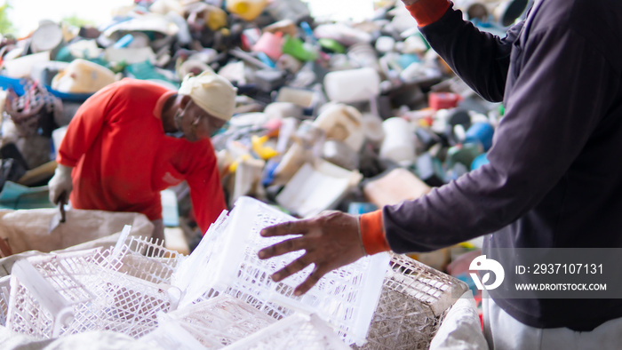 Workers are sorting plastic waste in the garbage factory