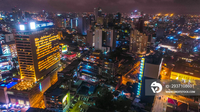 Road, lights and sea at night. Luanda city captured from the top