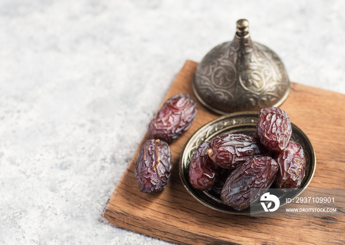 HURMA, Dates. Dried dates fruit on white background. Popular fruit of Ramadan.