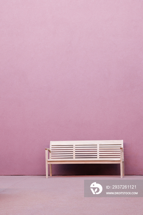 Bench in Front of Pink Wall