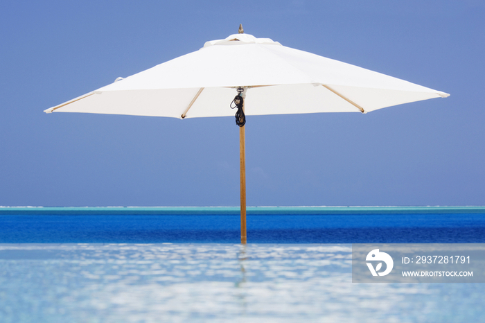 Open Beach Umbrella in Water