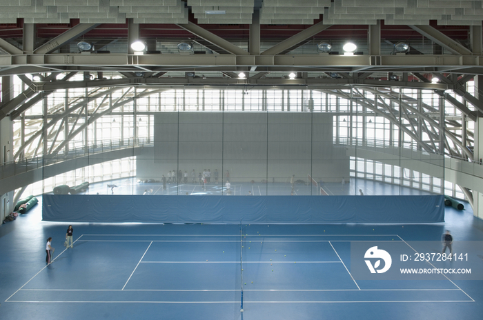 People playing tennis in sports club