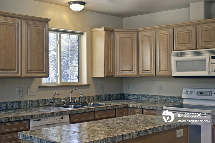 Kitchen island and wooden cabinets in kitchen