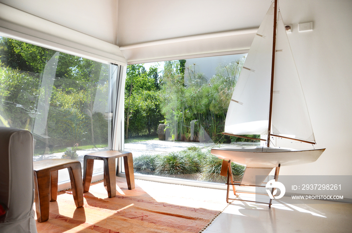 Sailboat model in seating area of middle class home