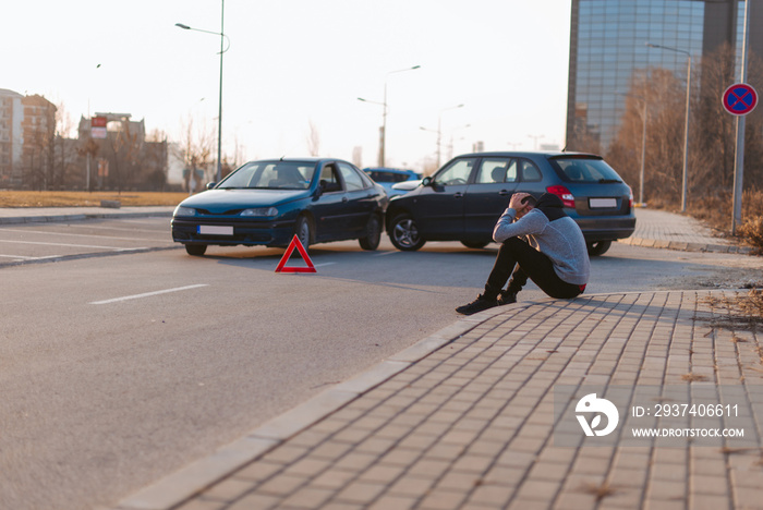 Two cars crashed on a sunny day