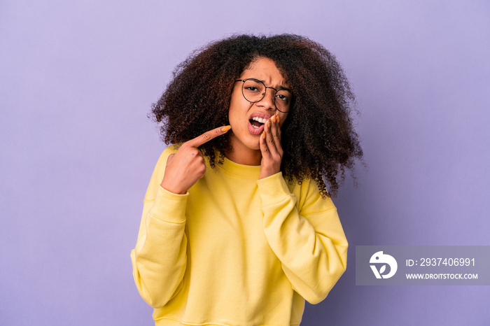 Young african american curly woman isolated on purple background having a strong teeth pain, molar a