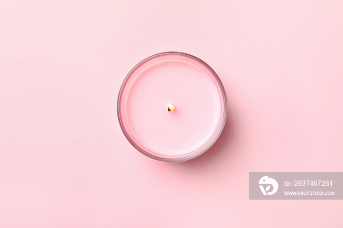 Scented candle for relax on pink background