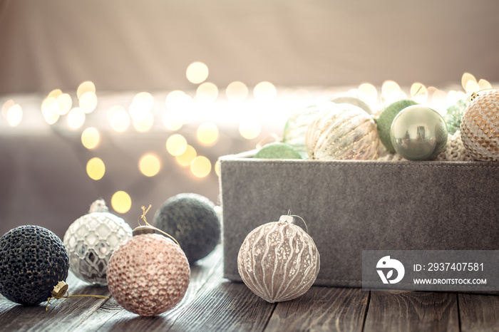 Christmas tree decorations over Christmas lights bokeh in home on wooden table. Holiday decoration