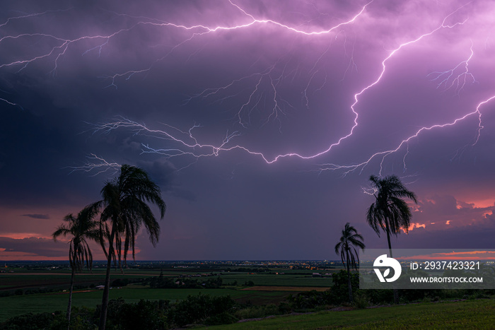 An electrical  storm passes behind the city of Bundaberg