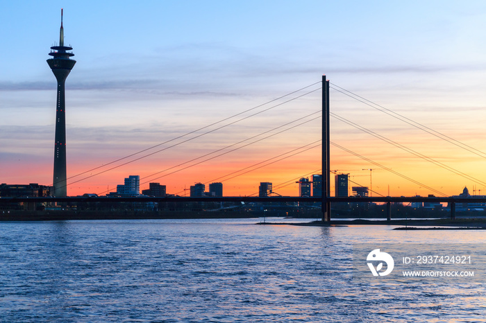 Sunset over the Riverside of Düsseldorf including the Rhine, Rheinturm and a Bridge