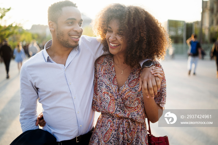 Smiling couple walking on street