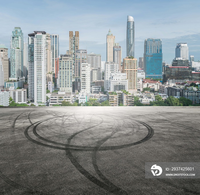 Cityscapes and Skyline of Urban Landscape in Bangkok Thailand, with a parking lot and car tire trace