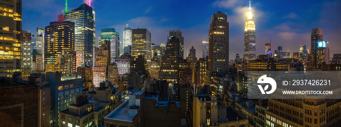 Panoramic view of Manhattan skyscrapers lights, New York city, in the evening