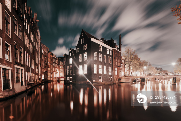 Amsterdam, canals and buildings at dusk, Netherlands.