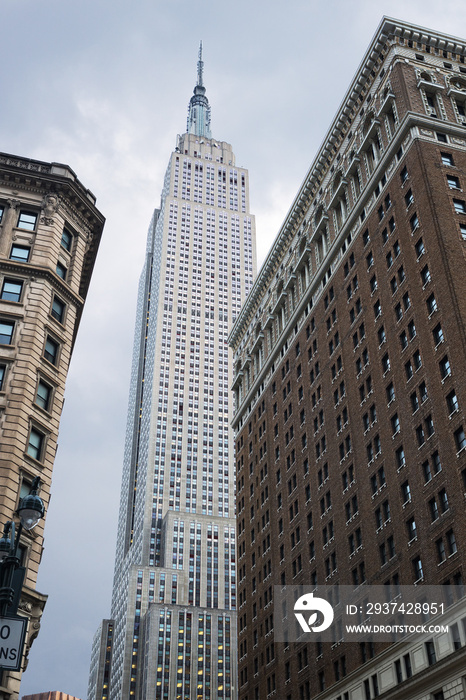 View looking up of the Empire State Building, seen from Herald Square,  New York City, United States