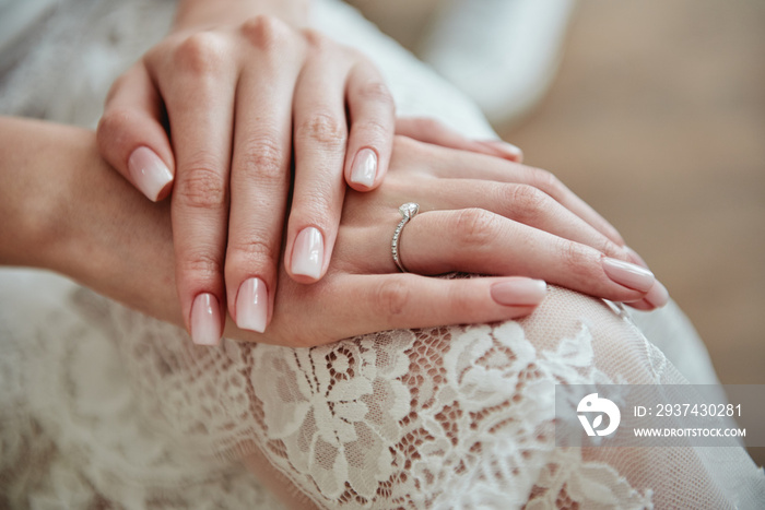 Close up of woman hands with pastel wedding manicure, copy space