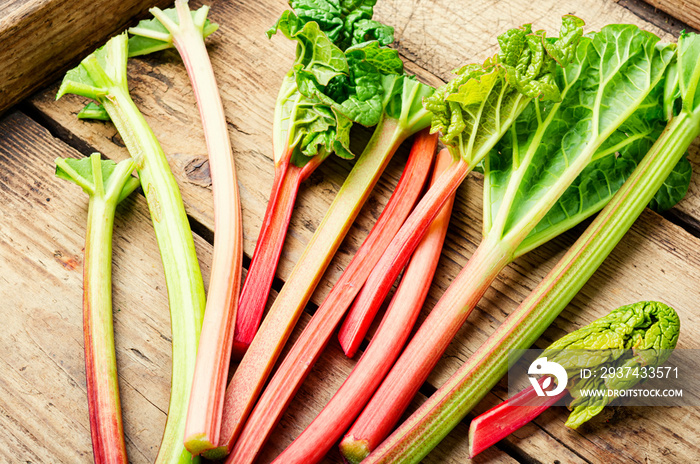 Rhubarb stems on wooden surface