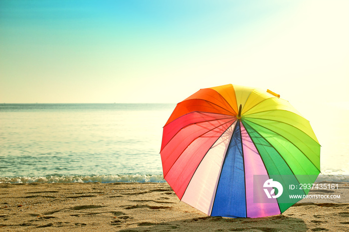 Colourful umbrella on the beach retro style