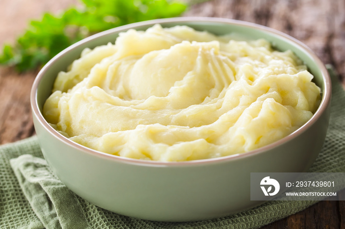 Fresh homemade creamy mashed potato in bowl (Selective Focus, Focus one third into the potato puree)