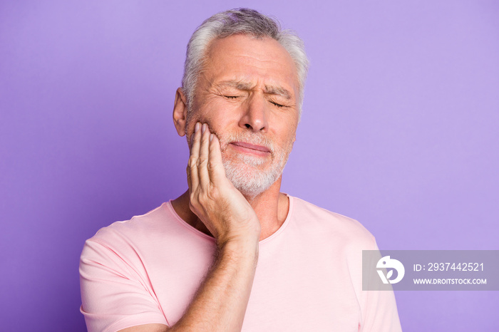 Close-up portrait of his he nice attractive sick grey-haired man touching cheek jaw feeling tooth pa