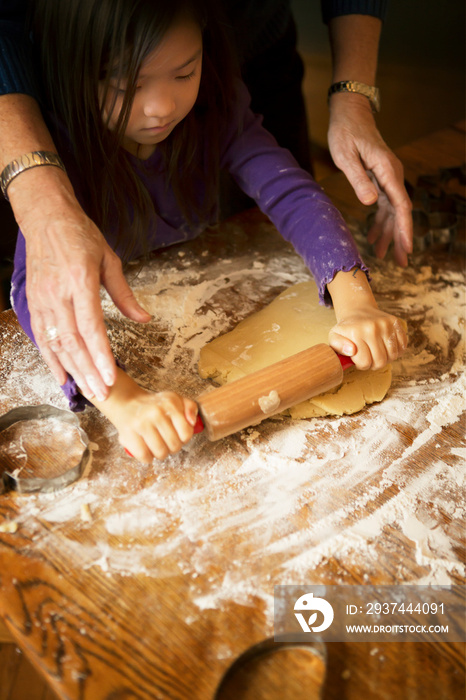 Grandmother baking with granddaughter (4-5)