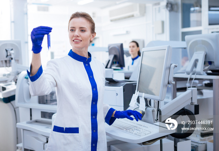 I need this. PSA test conducted by gorgeous blond female lab assistant who carrying the glassware an