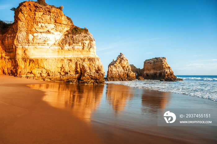 beautiful ocean landscape, the coast of Portugal, the Algarve, rocks on the sandy beach, a popular d