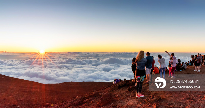 A crowd enjoying the sunset atop Mount Haleakala on Maui, Hawaii