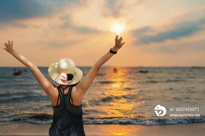 Freedom traveler girl standing with raised arms and enjoying a beautiful nature.