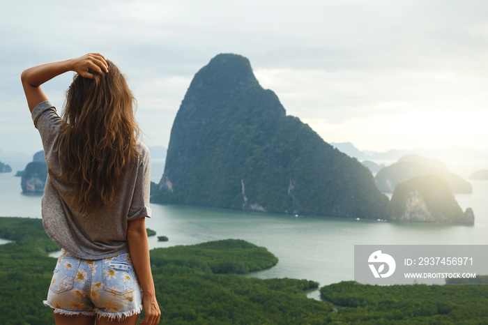 Young woman looking at the beautiful landscape