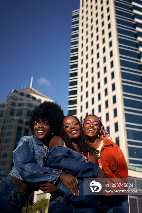 Portrait of young friend group together smiling in the city  