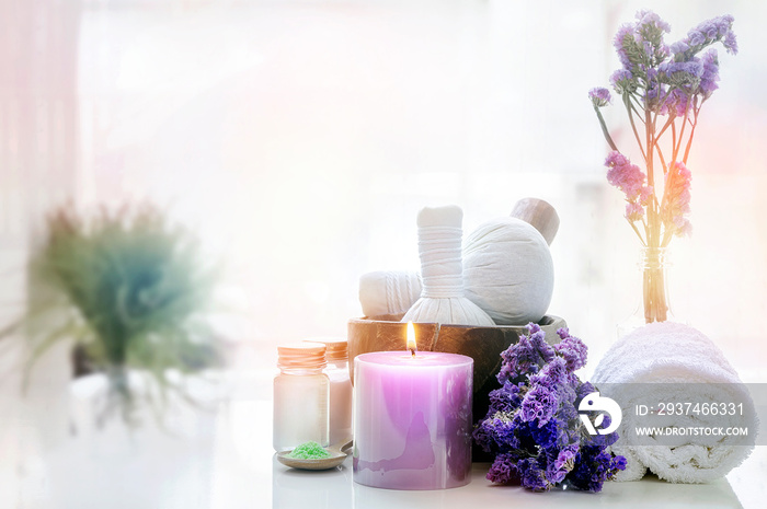 Spa treatments set on white table in bathroom background.