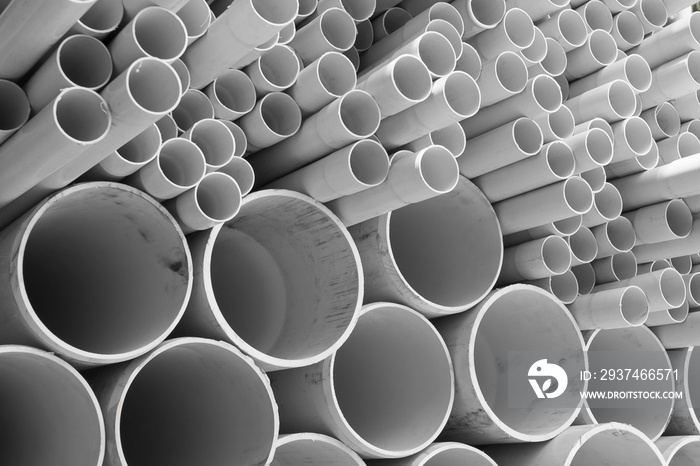 PVC pipes stacked in warehouse.