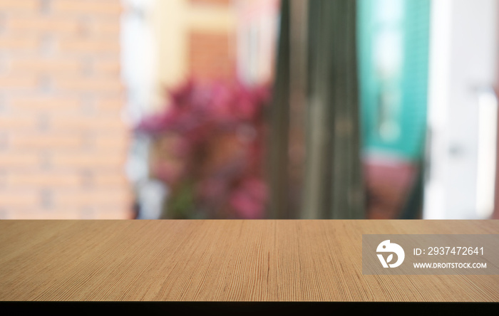 Empty dark wooden table in front of abstract blurred bokeh background of restaurant . can be used fo